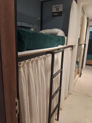 Uma cama ou camas num quarto em URB Hotel