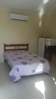 Uma cama ou camas num quarto em Rooftop na lagoa