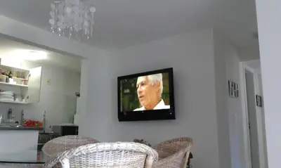Uma televisão e/ou sistema de entretenimento em Apartamento em Meireles