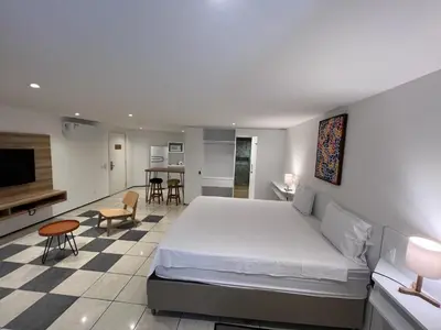 Uma cama ou camas num quarto em Particular Iate Plaza