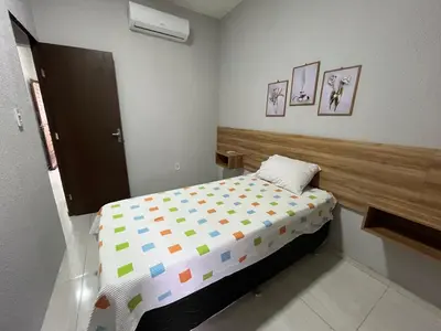 Uma cama ou camas num quarto em São José Village