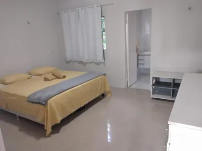 Uma cama ou camas num quarto em Linda casa em Guaramiranga