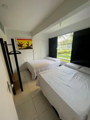 Uma cama ou camas num quarto em Apartamento 2 quartos a 230mts da Praia do Futuro com lazer completo 19