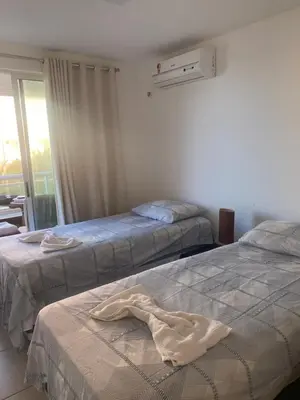 Uma cama ou camas num quarto em Breezes cumbuco vista mar