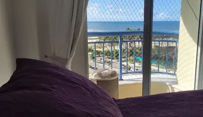 Uma varanda ou terraço em Beach Village 707 Norte frente ao mar