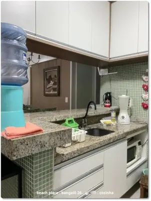 A cozinha ou kitchenette de Beach Place Resort . ap térreo