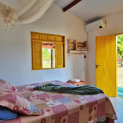 Uma cama ou camas num quarto em Sítio SPA Céu De Verdade , Praia de Barra Nova , Ceará