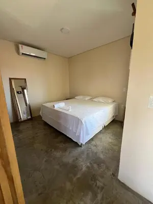 Uma cama ou camas num quarto em Pousada Veleiro Kite Preá