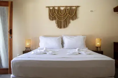 Uma cama ou camas num quarto em Pousada Veleiro Kite Preá
