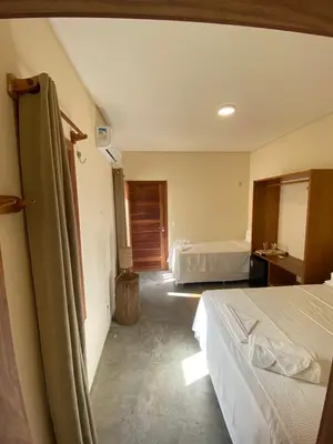 Uma cama ou camas num quarto em Pousada Veleiro Kite Preá