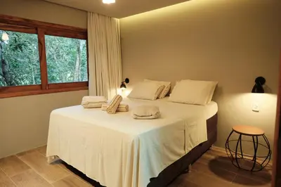Uma cama ou camas num quarto em Chalé encantador em Guaramiranga