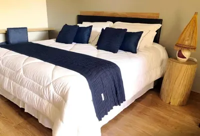 Uma cama ou camas num quarto em HOTEL IBIZA CUMBUCO