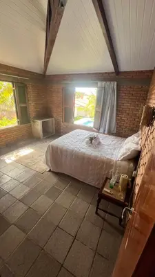 Uma cama ou camas num quarto em Casa Tijolinho - Barro Pret0, Aquiraz