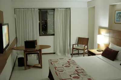 Uma televisão e/ou sistema de entretenimento em Best Hotel Sobral