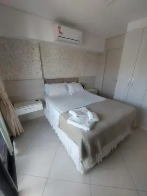 Uma cama ou camas num quarto em apartamento landscape beira-mar 1904D