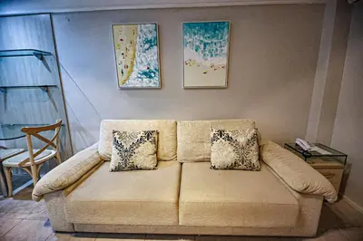 Uma área de estar em Flat Hotel Mercure Vista Mar