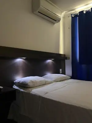 Uma cama ou camas num quarto em Hotel Sol Brasil
