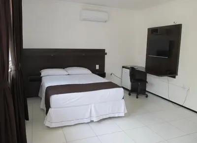 Uma cama ou camas num quarto em Hotel Sol Brasil