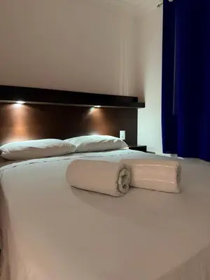 Uma cama ou camas num quarto em Hotel Sol Brasil