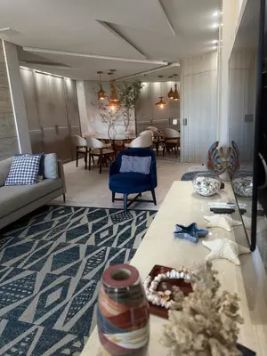 Uma área de estar em Apto Vista Mar alto padrão Paraíso das Dunas