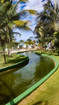 Um jardim no exterior de Apto Vista Mar alto padrão Paraíso das Dunas