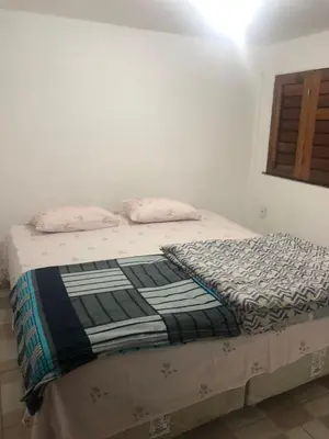 Uma cama ou camas num quarto em Casa Refúgio Familiar
