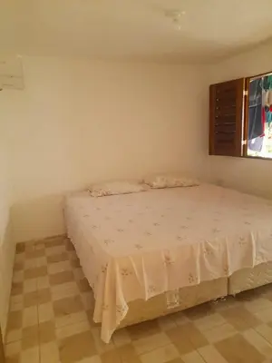 Uma cama ou camas num quarto em Casa Refúgio Familiar