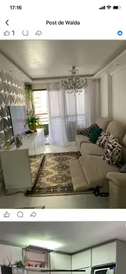 Uma área de estar em Apartamento com toda mobília nova de frente para o mar praia de iracema