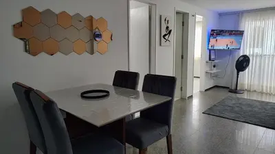 Uma televisão e/ou sistema de entretenimento em Familia VIP 4 Pessoas Praia de Iracema