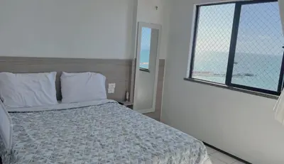 Uma cama ou camas num quarto em Familia VIP 4 Pessoas Praia de Iracema