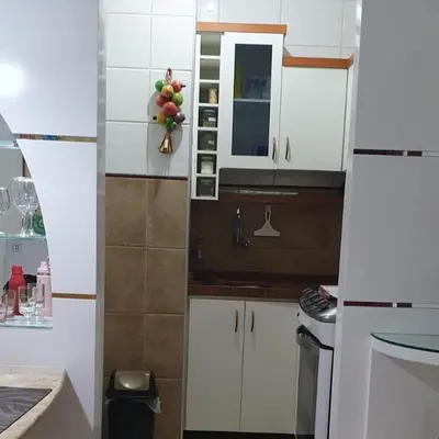 A cozinha ou kitchenette de Confortável apartamento a 100 m Beira Mar - Edifício Zen Residence