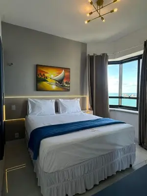 Uma cama ou camas num quarto em 952A Golden Flat Fortaleza