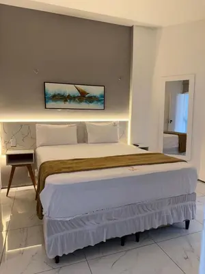 Uma cama ou camas num quarto em 957 golden fortaleza frente mar