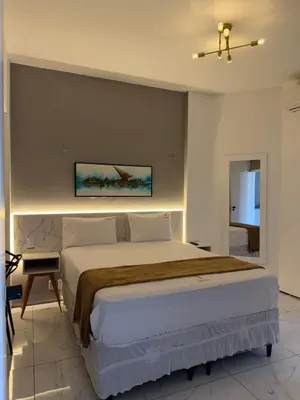 Uma cama ou camas num quarto em 957 golden fortaleza frente mar
