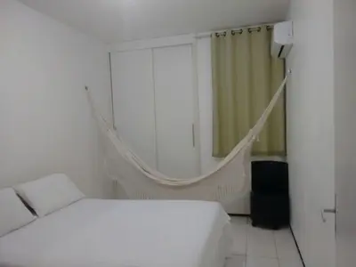 Uma cama ou camas num quarto em Residencial André Reis