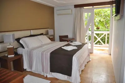 Uma cama ou camas num quarto em Hotel Porto Belo