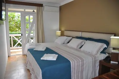 Uma cama ou camas num quarto em Hotel Porto Belo