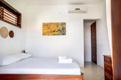 Uma cama ou camas num quarto em Pousada Meu Lugar