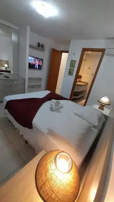 Uma cama ou camas num quarto em Porto Beach Conforto e Lazer a 200m do B Park