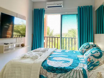 Uma cama ou camas num quarto em Beach Living - pé na areia, 200m do Beach Park