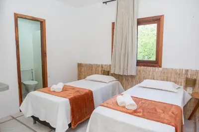 Uma cama ou camas num quarto em Casa Blue Parrot – Um Paraíso na Praia da Taíba