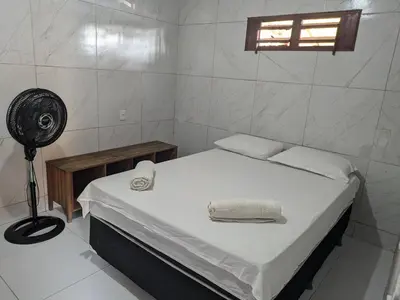 Uma cama ou camas num quarto em SOS Kite Hostel