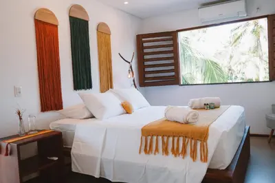 Uma cama ou camas num quarto em @Casa.Mauii - Ilha do Guajiru Luxurious House