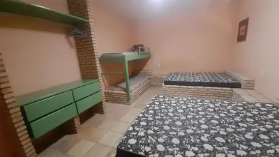 Uma cama ou camas num quarto em Flat Casa Taíba 2003