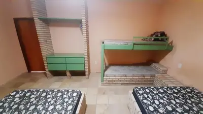 Uma cama ou camas num quarto em Flat Casa Taíba 2003