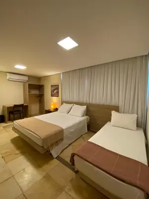 Uma cama ou camas num quarto em Pousada Tropical Ilhas