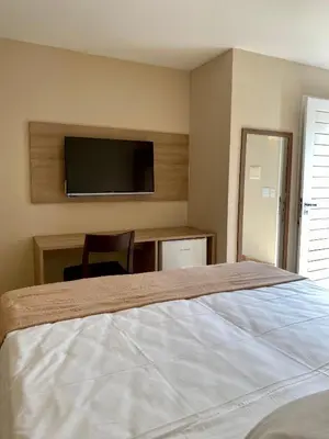 Uma cama ou camas num quarto em Pousada Tropical Ilhas