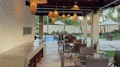 Um restaurante ou outro lugar para comer em Pousada Tropical Ilhas
