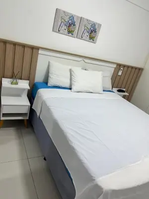 Uma cama ou camas num quarto em Newlife Residence