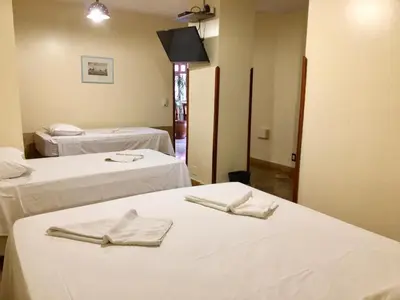 Uma cama ou camas num quarto em Pousada Fortal Villa Praia